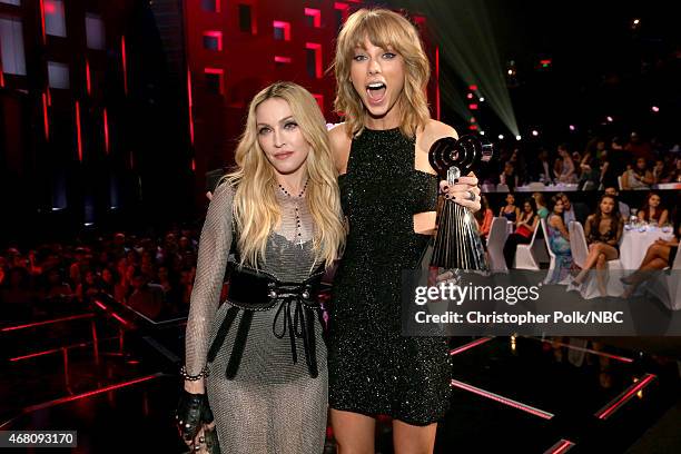 IHEARTRADIO MUSIC AWARDS -- Pictured: Recording artists Madonna and Taylor Swift pose at the iHeartRadio Music Awards held at the Shrine Auditorium...