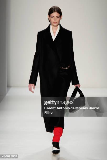 Model walks the runway at the Victoria Beckham presentation during Mercedes-Benz Fashion Week Fall 2014 at Cafe Rouge on February 9, 2014 in New York...