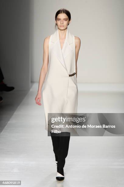 Model walks the runway at the Victoria Beckham presentation during Mercedes-Benz Fashion Week Fall 2014 at Cafe Rouge on February 9, 2014 in New York...