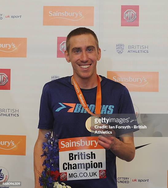 Lee Emanuel of City of Sheffield poses for a picture with his gold medal after winning the men's 1500m at the Sainsbury's British Athletics Indoor...