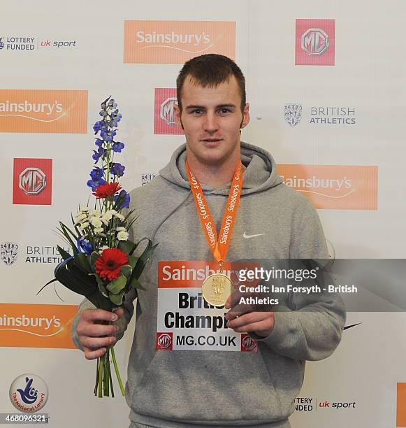 Luke Cutts of The Dearn poses for a picture with their gold medal after winning the men's Pole Vault at the Sainsbury's British Athletics Indoor...