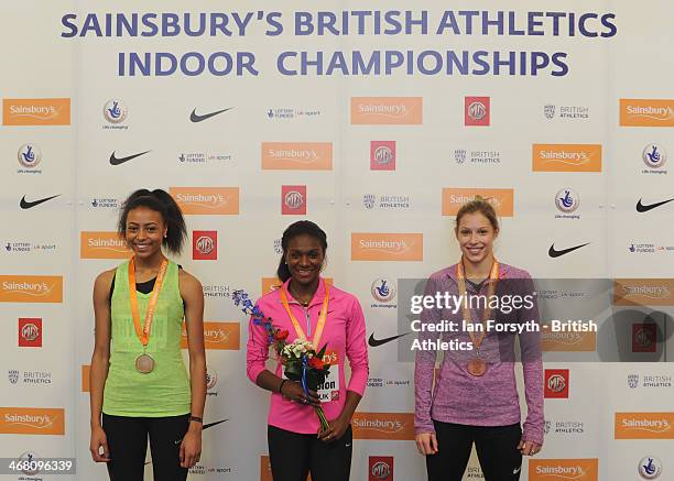 Dina Asher-Smith of Blackheath and Bromley poses for a picture with her gold medal with Shannon Hylton of the same club who won silver and Joey Duck...