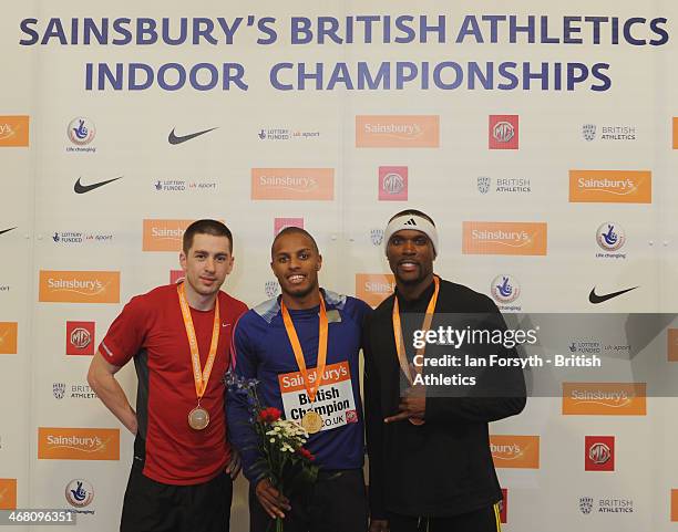 Chris Clarke of Newham poses for a picture with his gold medal with Ryan Oswald of Sale Harriers Manchester who won silver and Corad Williams who won...