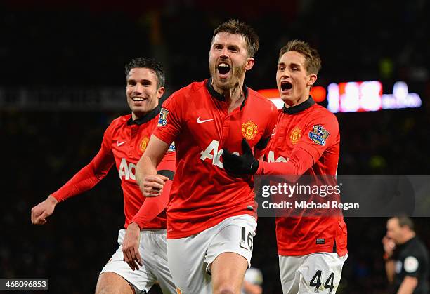 Michael Carrick of Manchester United celebrates scoring his team's second goal with Adnan Januzaj during the Barclays Premier League match between...