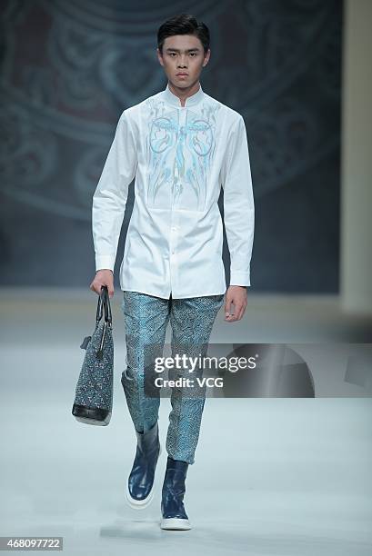 Model walks the runway during the Asahi Kasei Chinese Fashion Designer Creativity Award - Zeng Fengfei Collection as part of Mercedes-Benz China...