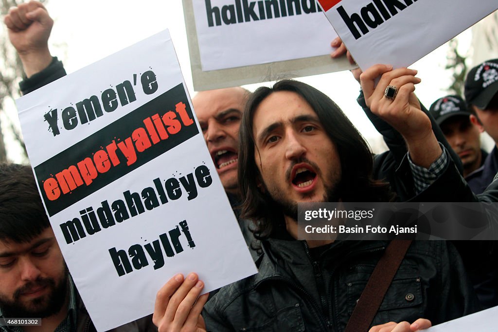 A man holds a banner that reads "Stop imperalist operation...