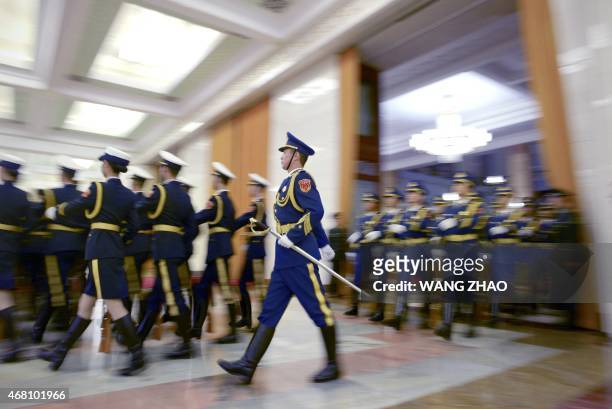 Chinese honour guards prepare for the arrival of Zambian President Edgar Lungu and Chinese President Xi Jinping during a welcome ceremony at the...