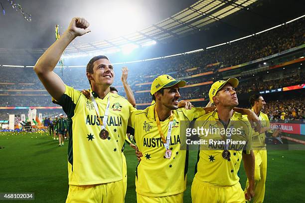 Josh Hazlewood, Mitchell Johnson and James Faulkner of Australia celebrate during the 2015 ICC Cricket World Cup final match between Australia and...