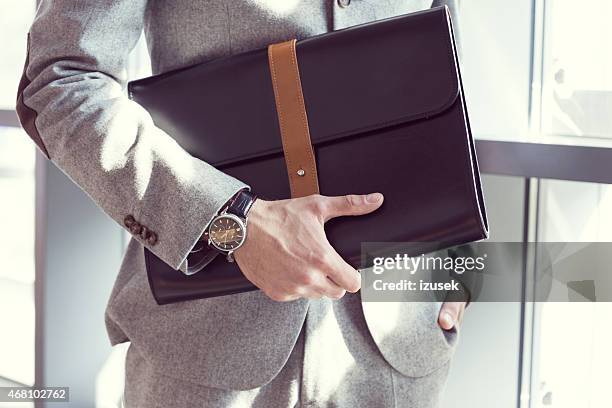 businessman holding briefcase, close up - briefcase stock pictures, royalty-free photos & images
