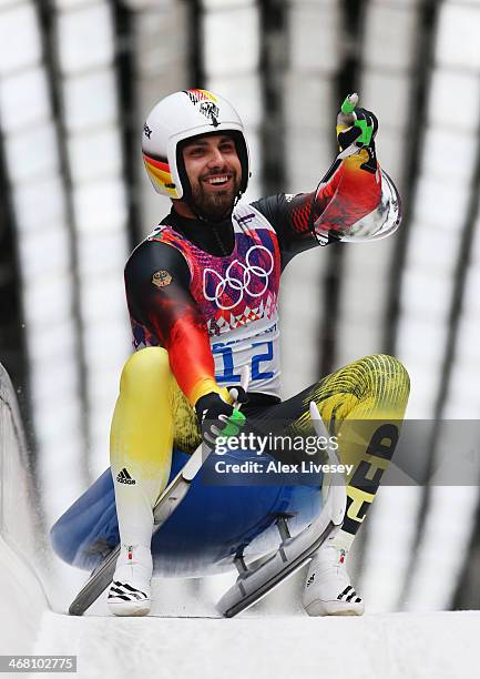 Andi Langenhan of Germany reacts after competing during the Men's Luge Singles on Day 2 of the Sochi 2014 Winter Olympics at Sliding Center Sanki on...