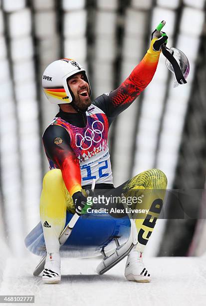 Andi Langenhan of Germany reacts after competing during the Men's Luge Singles on Day 2 of the Sochi 2014 Winter Olympics at Sliding Center Sanki on...