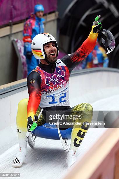 Andi Langenhan of Germany reacts after competing during the Men's Luge Singles on Day 2 of the Sochi 2014 Winter Olympics at Sliding Center Sanki on...