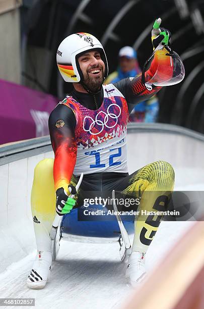 Andi Langenhan of Germany reacts after competing during the Men's Luge Singles on Day 2 of the Sochi 2014 Winter Olympics at Sliding Center Sanki on...