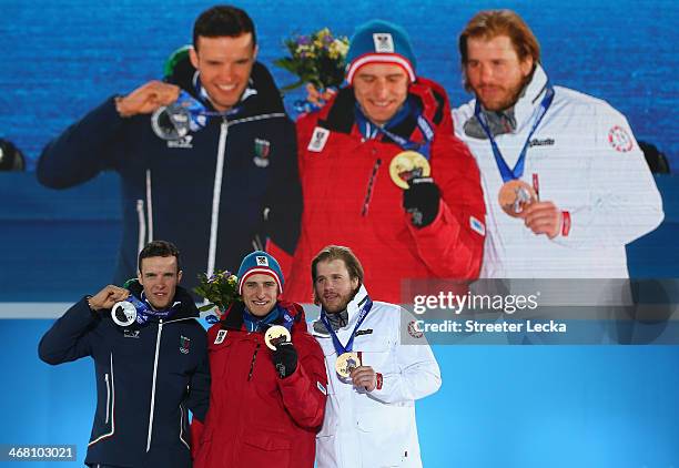 Silver medalist Christof Innerhofer of Austria, gold medalist Matthias Mayer of Austria and bronze medallist Kjetil Jansrud of Norway celebrate on...