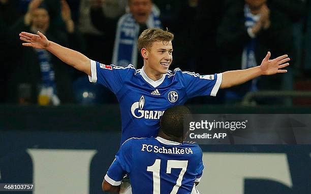 Schalke's Max Meyer celebrates his 2-0 goal with Peruvian midfielder Jefferson Farfan during the German first division Bundesliga football match FC...