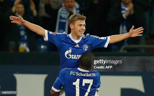 Schalke's Max Meyer celebrates his 2-0 goal with Peruvian midfielder Jefferson Farfan during the German first division Bundesliga football match FC...