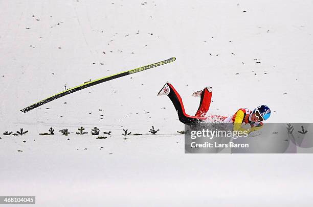 Severin Freund of Germany crashes upon landing during the Men's Normal Hill Individual first round on day 2 of the Sochi 2014 Winter Olympics at the...