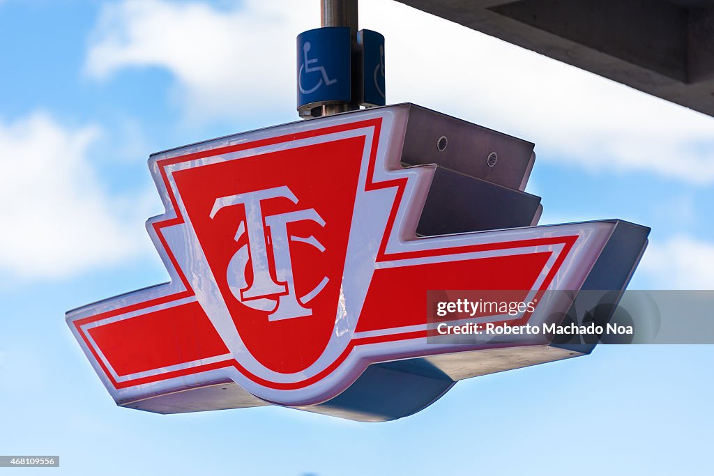 Toronto Transit Commision beautiful red sign over blue sky.