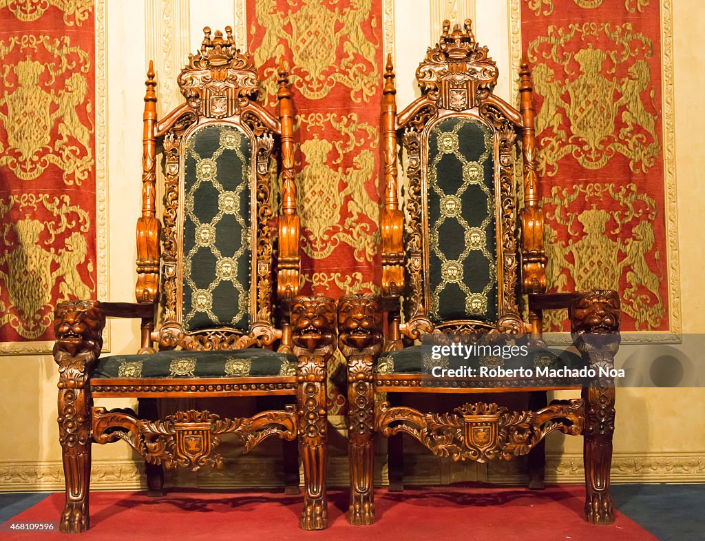 Beautiful luxurious medieval wooden seats in a castle hall,...