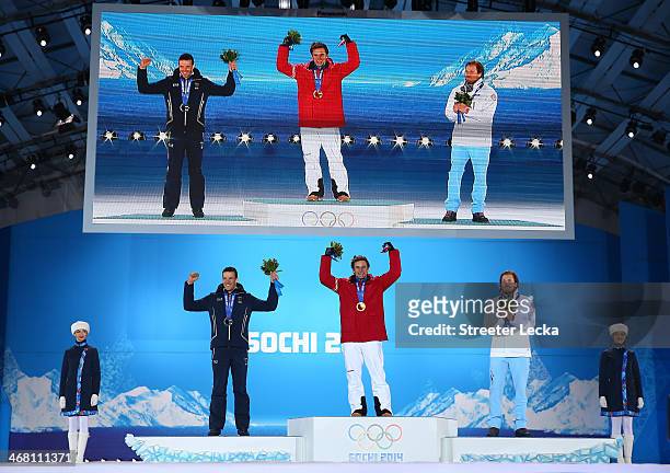 Silver medalist Christof Innerhofer of Austria, gold medalist Matthias Mayer of Austria and bronze medallist Kjetil Jansrud of Norway celebrate on...