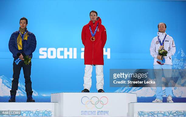 Silver medalist Christof Innerhofer of Austria, gold medalist Matthias Mayer of Austria and bronze medallist Kjetil Jansrud of Norway celebrate on...