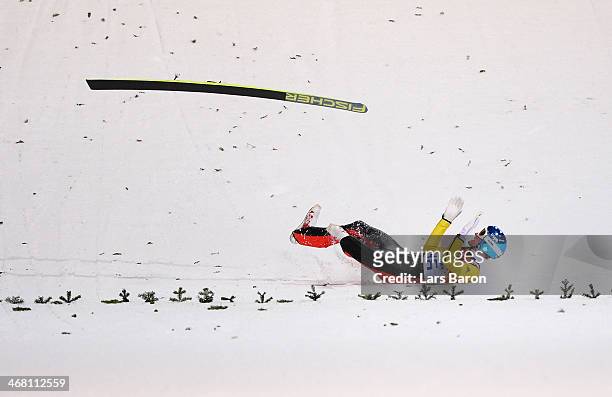 Severin Freund of Germany crashes upon landing during the Men's Normal Hill Individual first round on day 2 of the Sochi 2014 Winter Olympics at the...