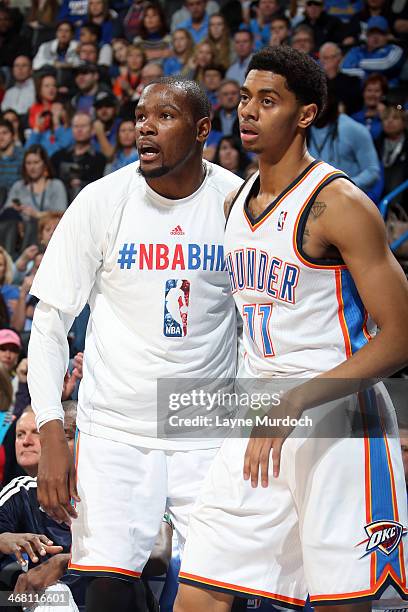 Kevin Durant and Jeremy Lamb of the Oklahoma City Thunder react during an NBA game against the New York Knicks on February 9, 2014 at the Chesapeake...