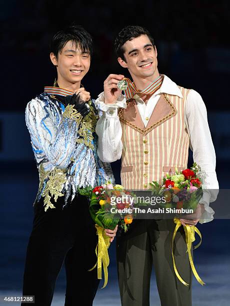 Second place winner Yuzuru Hanyu of Japan and first place winner Javier Fernandez of Spain pose for photographs at the award ceremony for Men's...