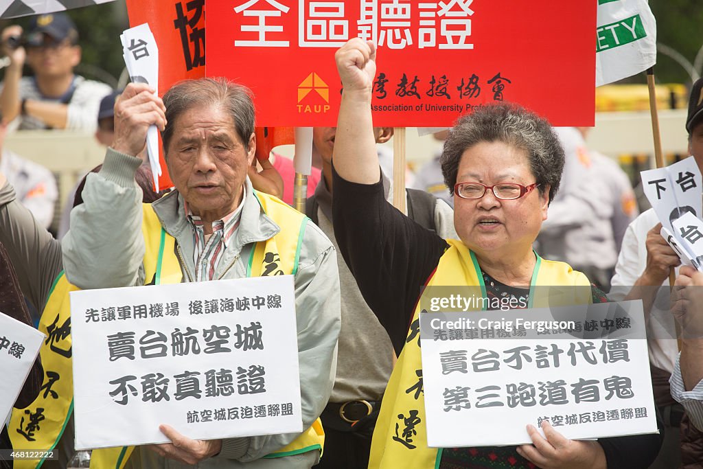 Fists raised in the air, participants in an anti-China...