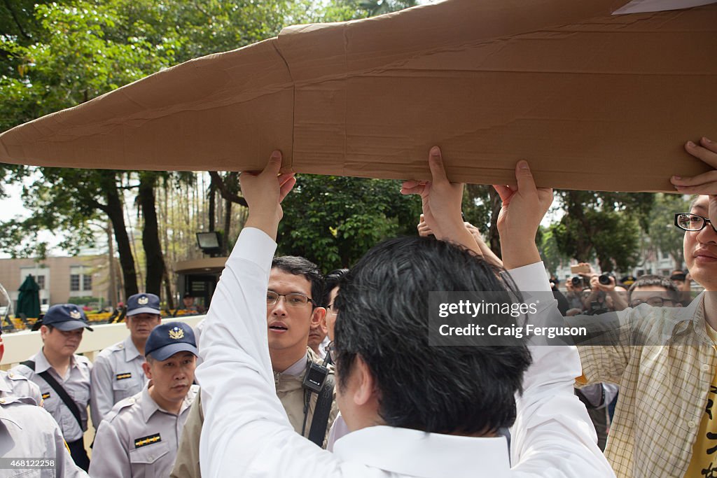 Human rights lawyer Lai Chung-chiang carries a symbolic...