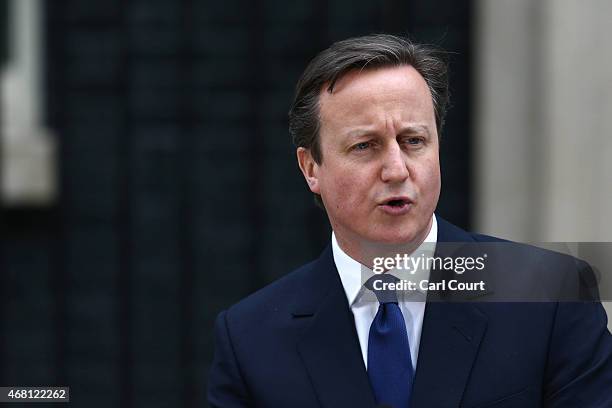 British Prime Minister David Cameron speaks in front of 10 Downing Street after meeting with Queen Elizabeth II on March 30, 2015 in London, England....