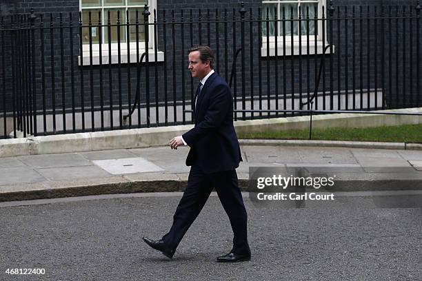 British Prime Minister David Cameron arrives to speak in front of 10 Downing Street after meeting with Queen Elizabeth II on March 30, 2015 in...