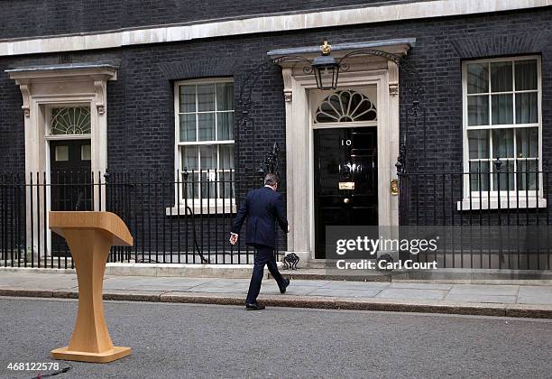 British Prime Minister David Cameron leaves after speaking in front of 10 Downing Street after meeting with Queen Elizabeth II on March 30, 2015 in...