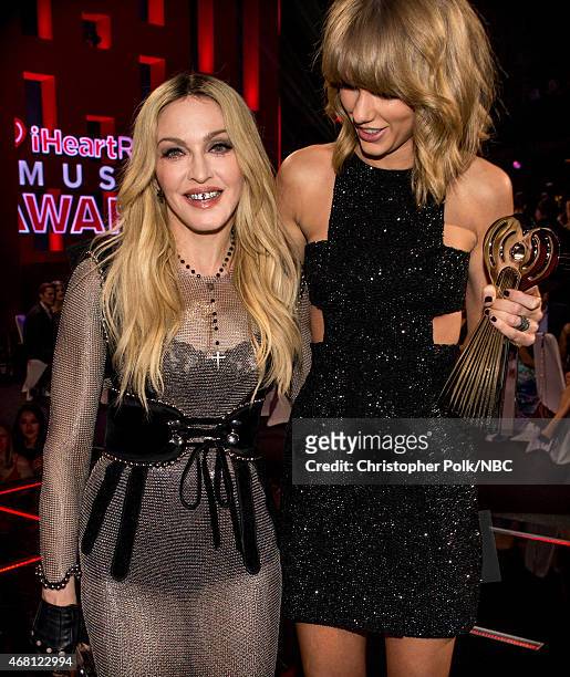 IHEARTRADIO MUSIC AWARDS -- Pictured: Recording artists Madonna and Taylor Swift pose at the iHeartRadio Music Awards held at the Shrine Auditorium...