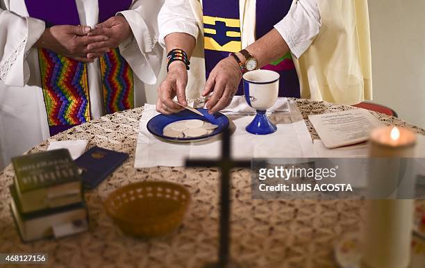 Colombian priest Olga Lucia Alvarez officiates a mass in Bogota on March 22, 2015. Alvarez is one of the four Latin American female priests members...
