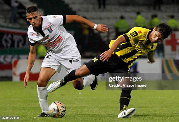 Cesar Quintero of Once Caldas, figths the ball with Arley Rodriguez of Alianza Petrolera during a match between Once Caldas and Alianza Petrolera for...