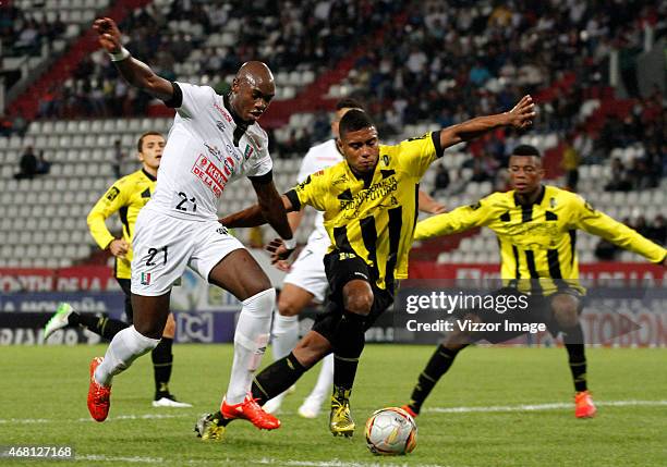 Jhon E. Valoy of Once Caldas, figths the ball with David A. Valencia of Alianza Petrolera during a match between Once Caldas and Alianza Petrolera...