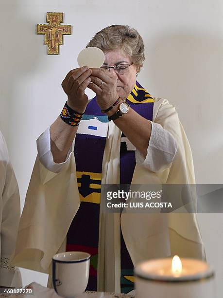 Colombian priest Olga Lucia Alvarez says mass in Bogota on March 22, 2015. Alvarez is one of four Latin American women priests, member of the Roman...