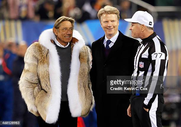 Former NFL players Joe Namath and Phil Simms talks with referee Terry McAulay before the Seattle Seahawks take on the Denver Broncos during Super...