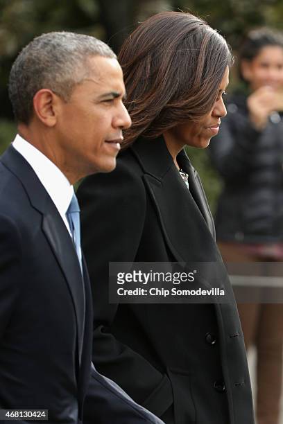 President Barack Obama and first lady Michelle Obama depart the White House March 30, 2015 in Washington, DC. The Obamas will travel to Boston to...