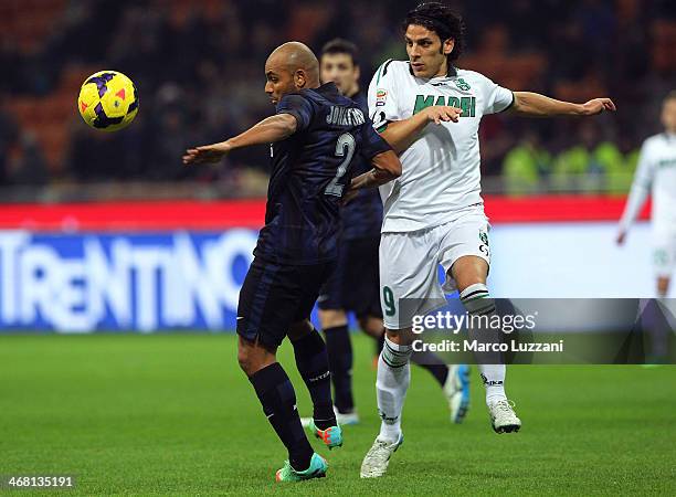 Cicero Moreira Jonathan of FC Internazionale Milano competes for the ball with Sergio Floccari of US Sassuolo Calcio during the Serie A match between...