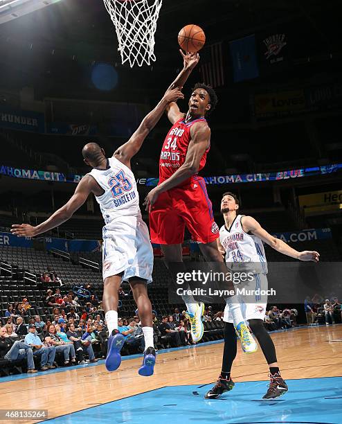 Hasheem Thabeet of the Grand Rapids Drive dunks against Chris Singleton of the Oklahoma City Blue during an NBA D-League game on March 15, 2015 at...
