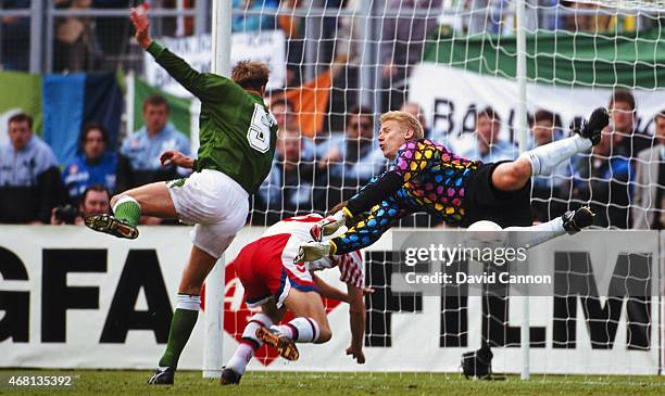 Denmark goalkeeper Peter Schmeichel makes a flying save from Republic of Ireland player Alan Kernaghan during a FIFA 1994 World Cup Qualifier at...