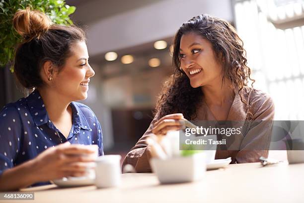 catching up over coffee - leanincollection stock pictures, royalty-free photos & images