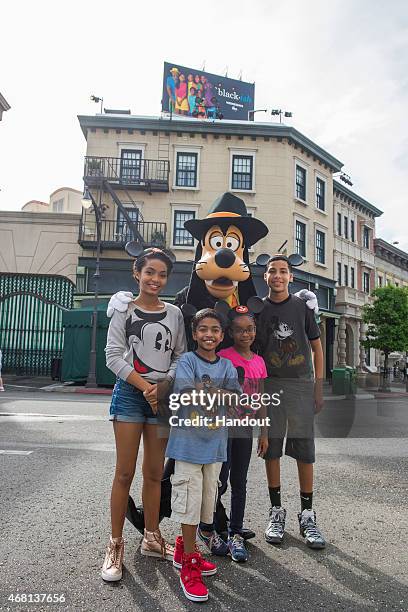 In this handout image provided by Disney Parks, Actors Yara Shahidi, Miles Brown, Marsai Martin, and Marcus Scribner, from the cast of the ABC series...