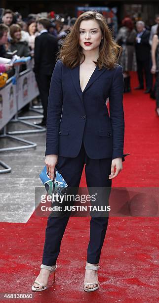 British actress Sophie Cookson poses for photographers as she arrives for the 2015 Empire Awards in central London on March 29, 2015. AFP PHOTO /...