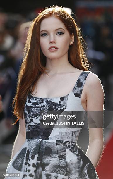 Actress Ellie Bamber poses for photographers as she arrives for the 2015 Empire Awards in central London on March 29, 2015. AFP PHOTO / JUSTIN TALLIS