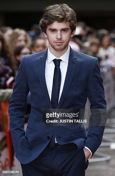 British actor Freddie Highmore poses for photographers as he arrives for the 2015 Empire Awards in central London on March 29, 2015. AFP PHOTO /...