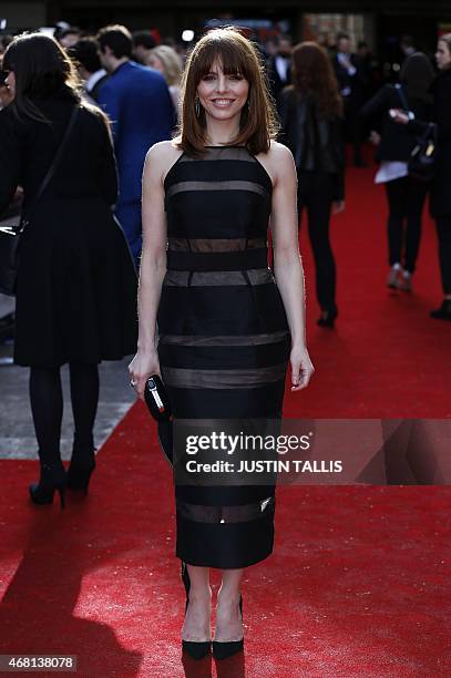 British actress Ophelia Lovibond poses for photographers as she arrives for the 2015 Empire Awards in central London on March 29, 2015. AFP PHOTO /...