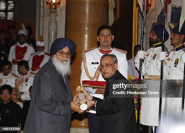 President Pranab Mukherjee presents Padma Vibhushan award to Chief Minister of Punjab Sardar Parkash Singh Badal during a Civil Investiture Ceremony...